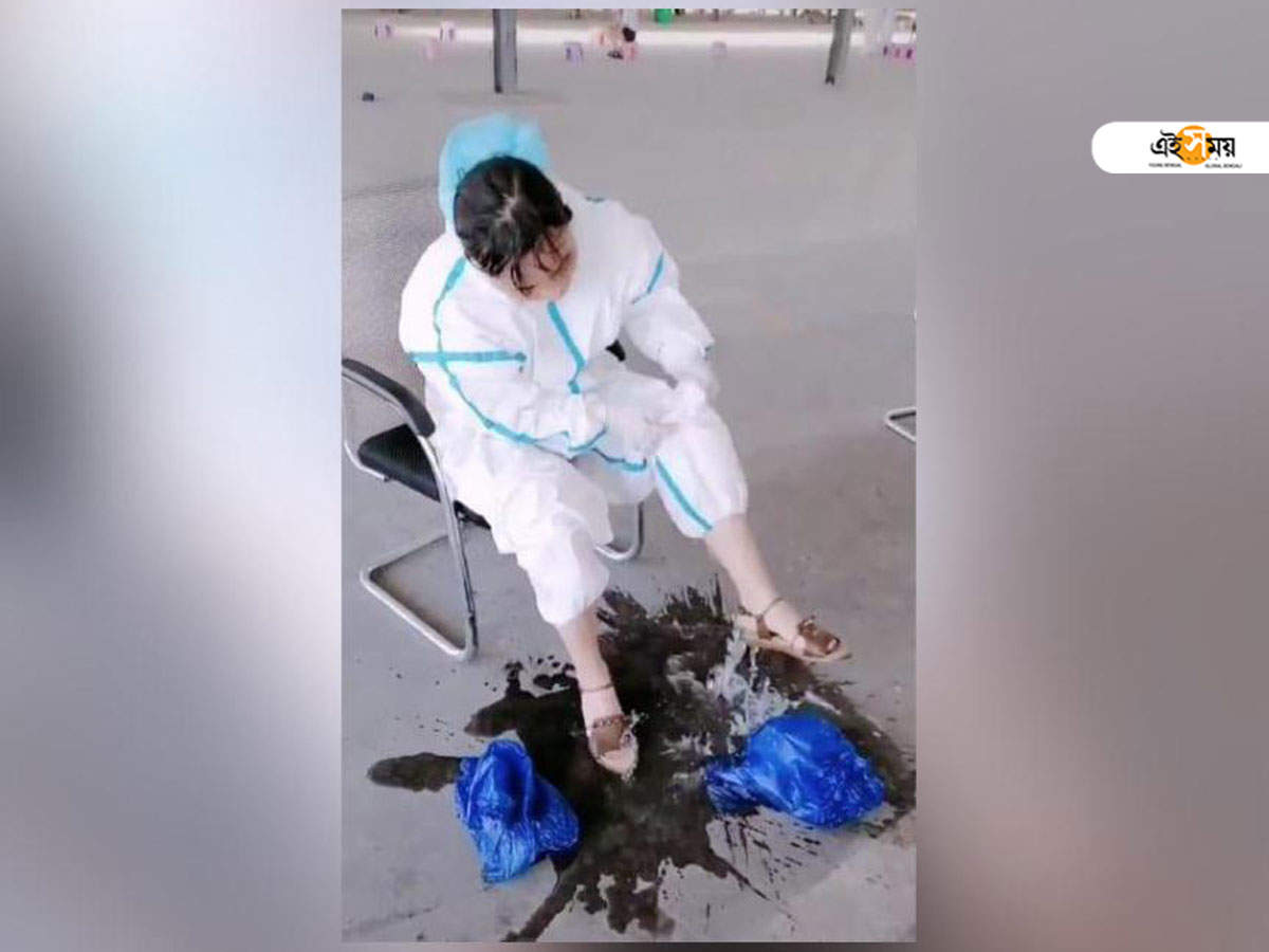 coronavirus: টানা ১২ ঘন্টা ডিউটি নার্সের, PPE স্যুট খুলতেই ঝড়ে পড়ল ‘এক বালতি ঘাম’! – covid-19 nurse pours out sweat from her ppe suit in china, video surfaces